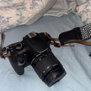 Canon Black DSLR with Brown Strap